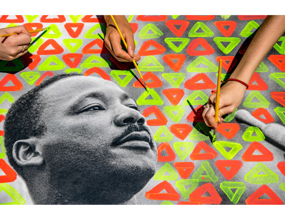 Art painted by hands with image of Martin Luther King Jr.